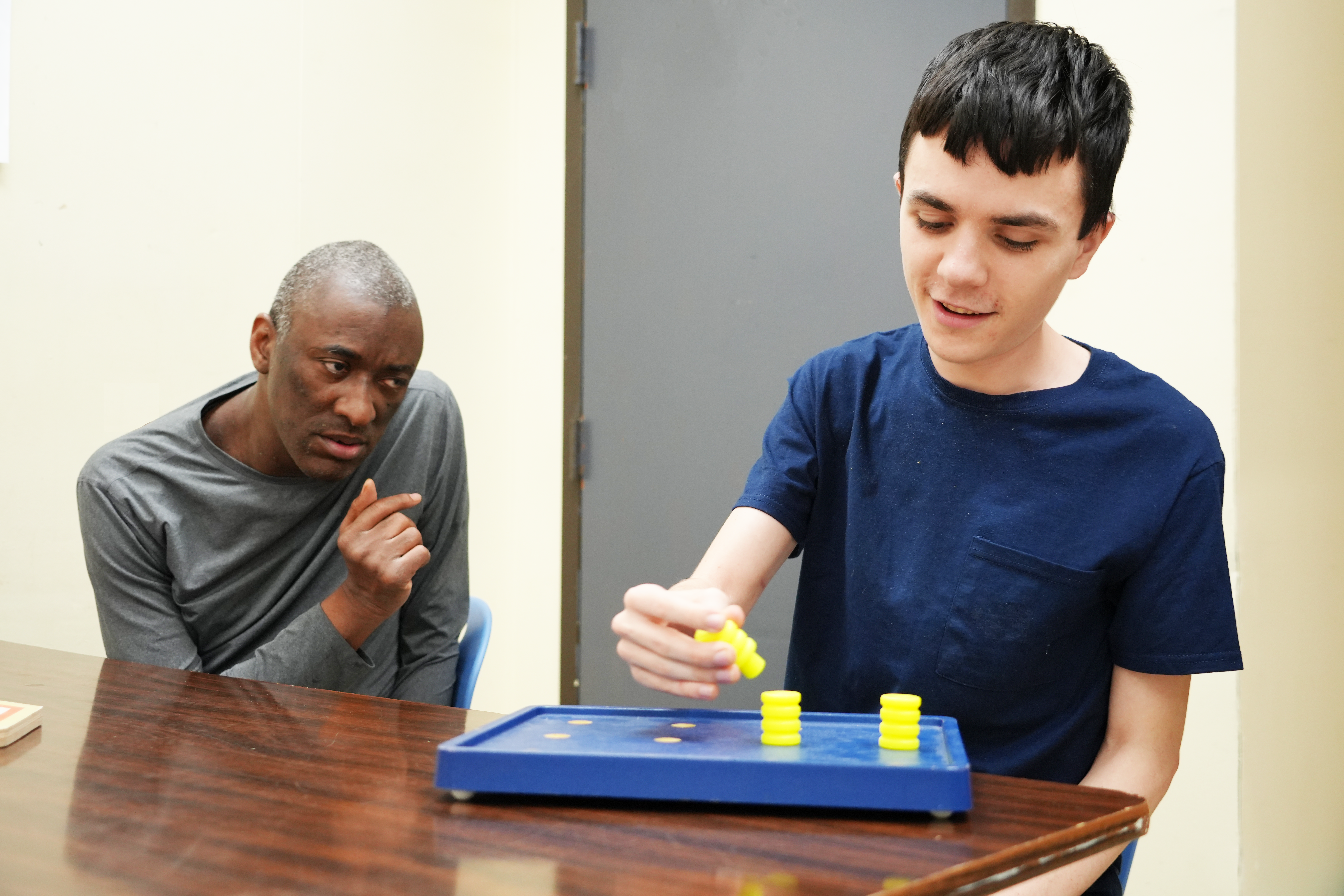 Two people working on a puzzle